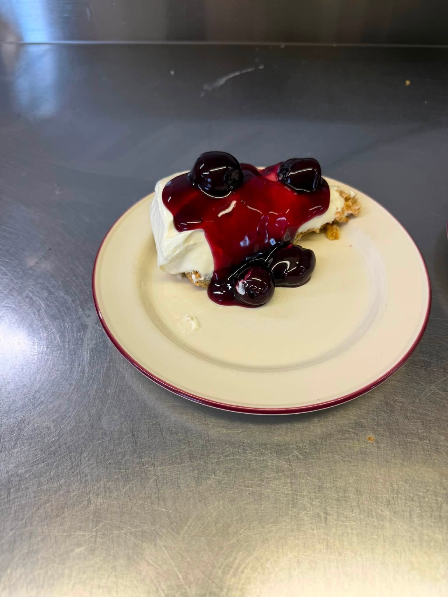 Slice of black cherry cheesecake