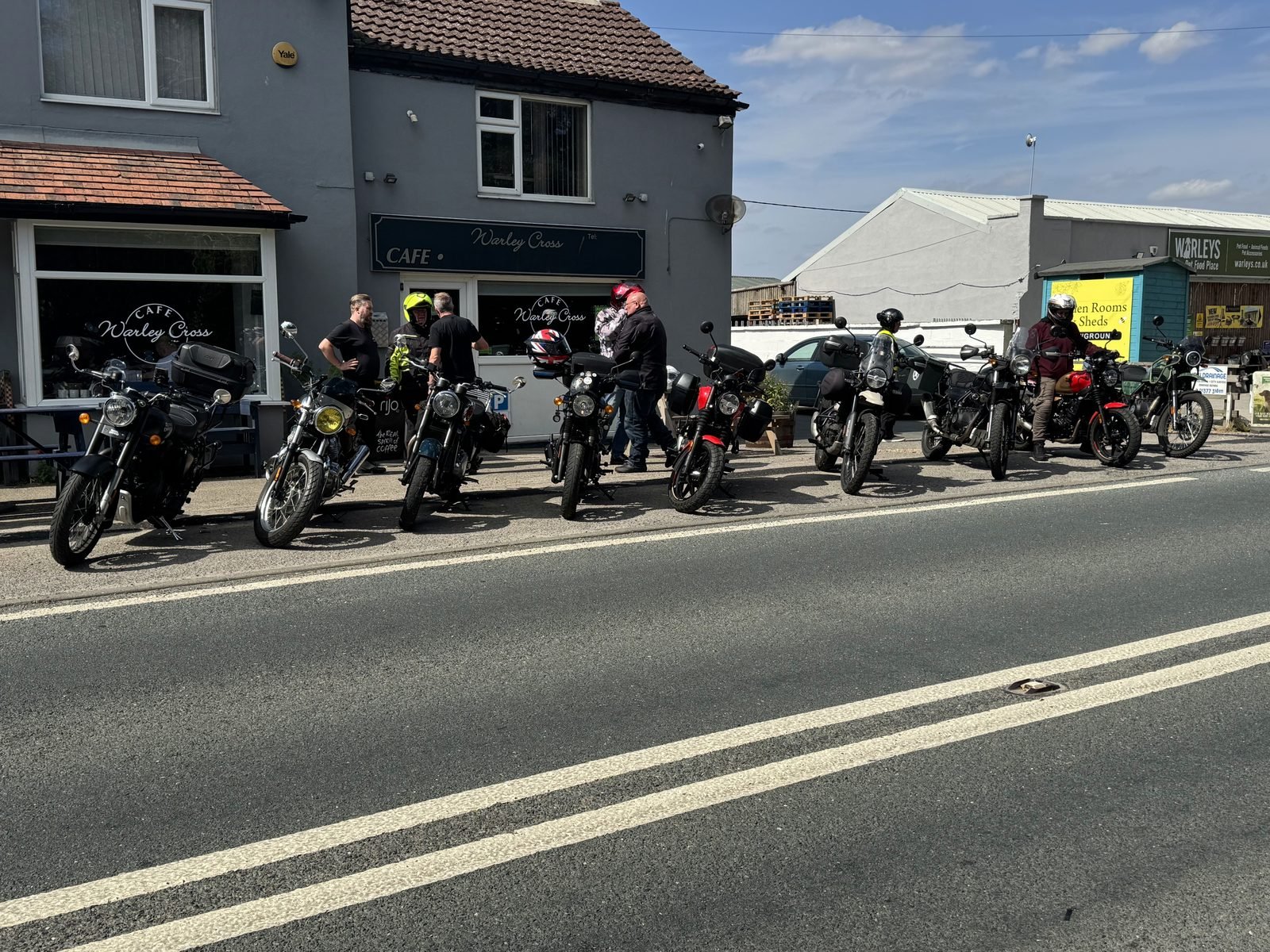 Row of motorbikes parked outside Warley Cross Cafe on Bike Night